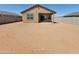 Vast backyard with a covered patio, ready for customization and outdoor enjoyment at 318 S San Fernando Ln, Casa Grande, AZ 85194