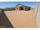 Expansive backyard offers a blank canvas for creating your dream outdoor living space at 318 S San Fernando Ln, Casa Grande, AZ 85194
