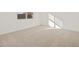 Carpeted bedroom featuring a window providing natural light at 318 S San Fernando Ln, Casa Grande, AZ 85194