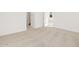 Bright carpeted bedroom with a bathroom in view at 318 S San Fernando Ln, Casa Grande, AZ 85194