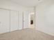 Carpeted bedroom with ensuite bathroom and closet at 318 S San Fernando Ln, Casa Grande, AZ 85194