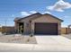 Lovely single-story home with a low-maintenance front yard and a convenient attached garage at 318 S San Fernando Ln, Casa Grande, AZ 85194