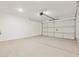Spacious two-car garage with ample room for parking and storage with a white door at 318 S San Fernando Ln, Casa Grande, AZ 85194