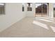 Open-concept living room with tile flooring and lots of bright, natural light at 318 S San Fernando Ln, Casa Grande, AZ 85194
