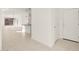 Bright living room with tile flooring, modern lighting, and an open layout at 318 S San Fernando Ln, Casa Grande, AZ 85194