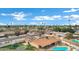 Aerial view of a home with a backyard pool and solar panels at 3222 W Hearn Rd, Phoenix, AZ 85053