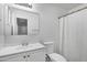 A well-lit bathroom with a single sink vanity and shower at 3222 W Hearn Rd, Phoenix, AZ 85053
