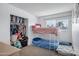This bright bedroom features a closet, window, and bunk beds at 3222 W Hearn Rd, Phoenix, AZ 85053