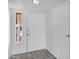 Bright entryway with tile flooring and a view of the front yard through the sidelight window at 3222 W Hearn Rd, Phoenix, AZ 85053