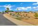 Front yard with raised garden beds in front of a house that has solar panels on the roof at 3222 W Hearn Rd, Phoenix, AZ 85053