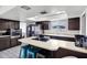 Kitchen with skylights, modern stainless appliances, and island with breakfast bar at 3222 W Hearn Rd, Phoenix, AZ 85053