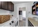 A laundry room complete with modern appliances and ample storage space at 3222 W Hearn Rd, Phoenix, AZ 85053