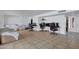 Spacious living room featuring tile flooring, a ceiling fan and versatile layout for various activities at 3222 W Hearn Rd, Phoenix, AZ 85053