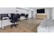 Spacious and brightly lit living room with tile flooring and dedicated workspace area at 3222 W Hearn Rd, Phoenix, AZ 85053