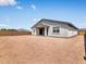 Exterior view of the backyard showing the layout, patio, and surrounding fence at 345 S Alegria Ln, Casa Grande, AZ 85194