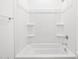 A crisp, clean white bathtub shower combo offers a serene space for relaxation at 345 S Alegria Ln, Casa Grande, AZ 85194