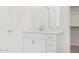 This bathroom vanity features white cabinets and a large mirror at 345 S Alegria Ln, Casa Grande, AZ 85194