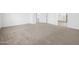 This bedroom has neutral carpet, white trim, and views into other rooms at 345 S Alegria Ln, Casa Grande, AZ 85194