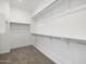 This walk-in closet has carpet flooring and shelving around three walls at 345 S Alegria Ln, Casa Grande, AZ 85194