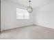Bright and airy dining room with tile floors features pendant lighting and a large window at 345 S Alegria Ln, Casa Grande, AZ 85194