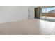 Neutral living room with sliding doors to the patio is awaiting it's new homeowner's creativity at 345 S Alegria Ln, Casa Grande, AZ 85194