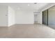 Neutral living room features sliding doors to the patio and recessed lights at 345 S Alegria Ln, Casa Grande, AZ 85194