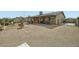 Extensive backyard featuring a covered patio, outdoor kitchen area, and ample space for recreation at 3514 W Charleston Ave, Glendale, AZ 85308