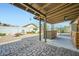 Spacious backyard with covered patio, outdoor kitchen, and fire pit area at 3514 W Charleston Ave, Glendale, AZ 85308