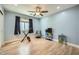 Bright and airy bedroom with wood floors and a ceiling fan, perfect for relaxation at 3514 W Charleston Ave, Glendale, AZ 85308