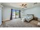Bedroom features a sliding glass door to the yard, and neutral décor at 3514 W Charleston Ave, Glendale, AZ 85308