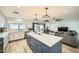 Open kitchen with stainless appliances, a center island, and modern pendant lighting at 3514 W Charleston Ave, Glendale, AZ 85308