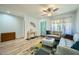 Bright living room features modern decor, a ceiling fan, and a comfortable seating area at 3514 W Charleston Ave, Glendale, AZ 85308