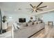 Cozy living room with modern decor, a large TV, and stylish furnishings at 3514 W Charleston Ave, Glendale, AZ 85308