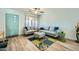 Bright living room featuring modern furnishings, neutral decor, and wood-look floors at 3514 W Charleston Ave, Glendale, AZ 85308