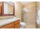 Neutral bathroom with granite counters and a glass enclosed walk-in shower at 36600 N Cave Creek Rd # 17D, Cave Creek, AZ 85331