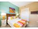 Stylish bedroom with bright colors, a decorative bedspread, and a closet at 36600 N Cave Creek Rd # 17D, Cave Creek, AZ 85331
