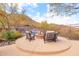 Cozy fire pit with comfortable seating overlooking desert landscape at 36600 N Cave Creek Rd # 17D, Cave Creek, AZ 85331