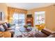 Cozy living room with a fireplace, comfortable seating, and access to an outdoor patio at 36600 N Cave Creek Rd # 17D, Cave Creek, AZ 85331