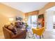 Cozy living room with leather sofas, fireplace, balcony, and colorful decor at 36600 N Cave Creek Rd # 17D, Cave Creek, AZ 85331