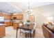 Open-concept living area with a dining table, modern chandelier, and cozy living room area at 36600 N Cave Creek Rd # 17D, Cave Creek, AZ 85331