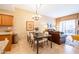 Living space featuring a dining table, comfortable sofa, and bright natural light at 36600 N Cave Creek Rd # 17D, Cave Creek, AZ 85331