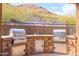Outdoor grilling area with stainless steel appliances and stone accents at 36600 N Cave Creek Rd # 17D, Cave Creek, AZ 85331