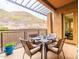 Cozy outdoor patio area with mountain views, stylish furniture, and dining set for four at 36600 N Cave Creek Rd # 17D, Cave Creek, AZ 85331