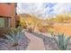 Scenic landscaped pathway leading to residences with desert vegetation and beautiful surroundings at 36600 N Cave Creek Rd # 17D, Cave Creek, AZ 85331