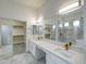 Bright bathroom featuring double vanity with white counters, sleek sinks, and a spacious walk-in shower at 3918 E Carson Rd, Phoenix, AZ 85042