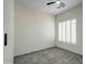 Bedroom with tile floors, white walls, large windows, and a ceiling fan at 3918 E Carson Rd, Phoenix, AZ 85042
