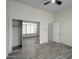 Bedroom with tile floors and sliding door closet at 3918 E Carson Rd, Phoenix, AZ 85042