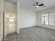 This bedroom features wood look ceramic tile flooring and lots of natural light at 3918 E Carson Rd, Phoenix, AZ 85042
