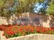Community entrance sign for 'The Pines' with red flower beds at 3918 E Carson Rd, Phoenix, AZ 85042