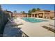 Community pool with lounge chairs and a covered patio area at 3918 E Carson Rd, Phoenix, AZ 85042